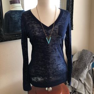 Blue, sheer, v-neck, long sleeved shirt.